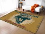Tapis dinosaure motif periode jurassique devant un canapé blanc